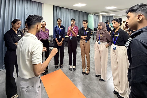 Students taking part in a group communication activity