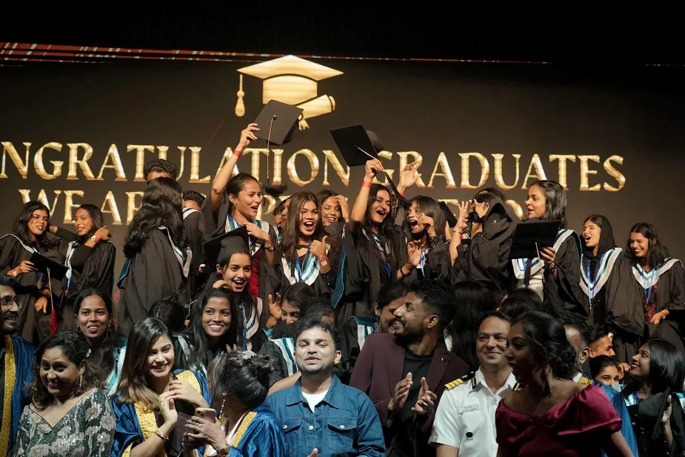 Neerja School of Aviation graduates in gowns celebrating together