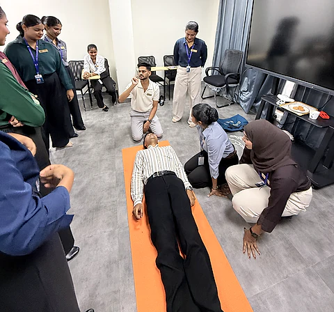 Students practising an emergency response drill on a classroom floor mat