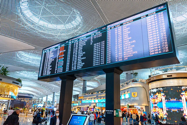 Flight information boards in an airport departure hall